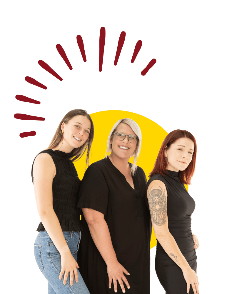 Three Hero Digital Lab team members standing together in a friendly group photograph.